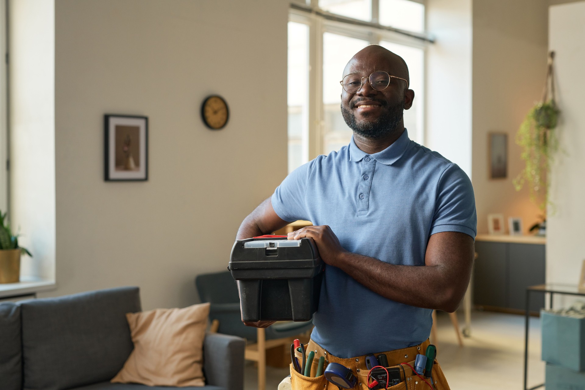 Smiling Black Man Holding Toolbox